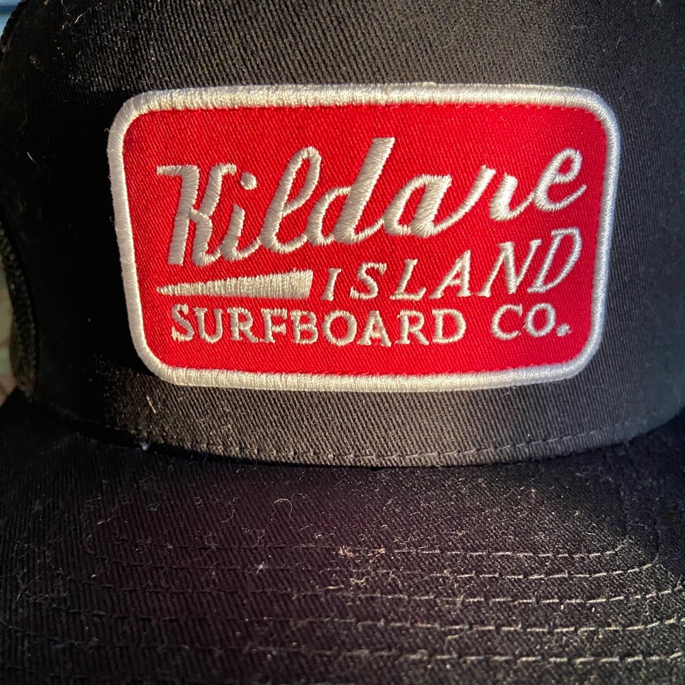 “Kildare Island” flat rim trucker hat from OBX Netflix by Volcom.